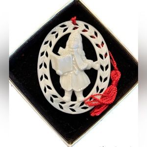 Lennox Porcelain Christmas Caroler ornament rimmed in gold.
